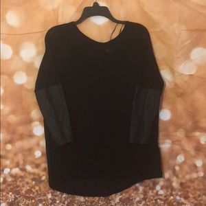 Oversized black sweater with PU sleeves